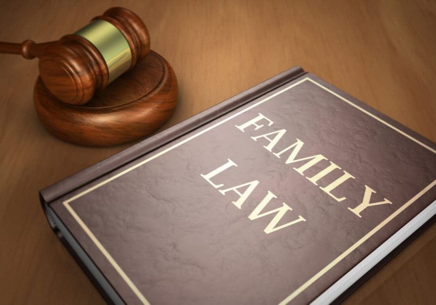 family-law-book Family law concept with sign printed on a book and a gavel on a wooden desk.