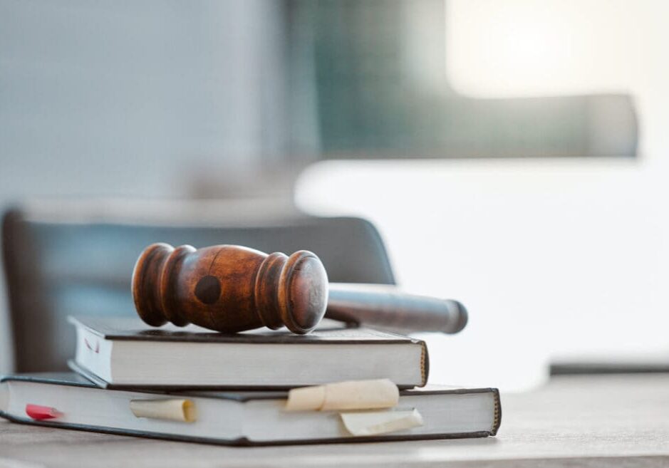 gavel-and-law-books gavel and law books on table in office for court trial